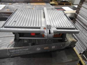 lot 71 image: RIDGID 6.5 Amp Corded 7 in. Table Top Wet Tile Saw