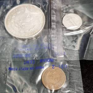lot 30 image: 3 COINS IN SEALED LITTLETON PACKAGING AS PICTURED