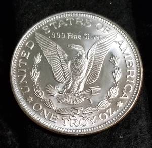lot 32 image: 1 TROY OZ. .999 FINE SILVER MORGAN DOLLAR DESIGN
