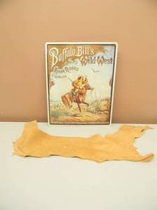 lot 29 image: BUFFALO BILL WILD WEST SHOW TIN - APPROX 12 BY 15 - & ANIMAL HIDE - SEE PICTURES