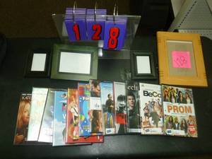 lot 128 image: 12 Dvds & picture frames. As shown. SEE TERMS