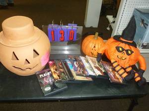 lot 130 image: 12 Dvds & Halloween decorations. As shown. SEE TERMS