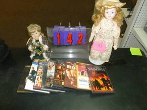 lot 142 image: 9 Dvds & Dolls. As shown. SEE TERMS