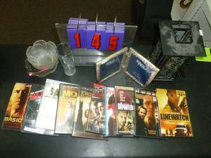 lot 145 image: 10 Dvds & misc glassware & candles. As shown. SEE TERMS