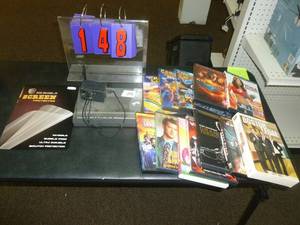 lot 148 image: 12 Dvds & Gateway Router. As shown. SEE TERMS