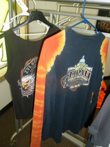 lot 162 image: Leather Jacket & 15 T-shirts. Many are Harley Davidson. Assorted sizes. As shown. SEE TERMS