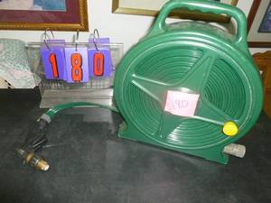 lot 180 image: Roll up garden hose. As shown. SEE TERMS