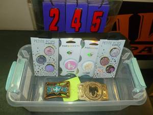 lot 245 image: Pop Sockets & Belt Buckles. As shown. SEE TERMS