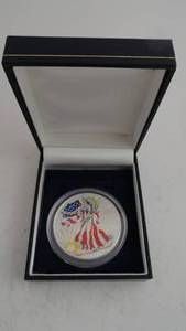 lot 9 image: 1999 American Silver Eagle 1 oz fine Silver Full color silver