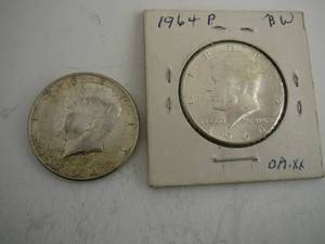 lot 99 image: 2- 1964 Kennedy Half Dollars