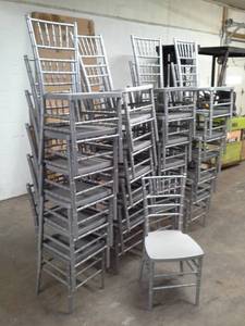 lot 104 image: Lot of (Approximately 25) Drake Corp. 36in. SilverGrey Stackable Plastic Banquet Chairs