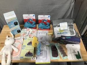 lot 33 image: Baby Lot with over 20 items Childproofing, safety, bath spout covers, star projectors, Hakaa Manual Pump, Breastfeeding Covers, Plush toy, Storybook toy