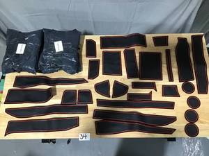 lot 34 image: Lot of 6 Universal Fit Replacement Car Interior Cup holder, Door & Center Console lineranti-dust mats in Black & Red- Each kit has 28 pieces, Lot of 6 Kits