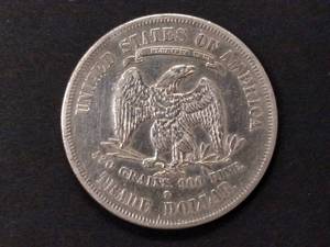 lot 5 image: 1877 S Trade Silver Dollar...