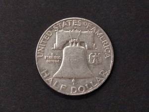 lot 101 image: 1957 D Franklin Silver Half Dollar...