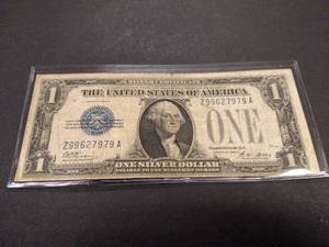 lot 141 image: 1928 A Funny Back One Dollar Silver...