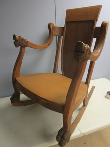 lot 112 image: SOLID WOOD ROCKER, WITH DECORATIVE ANIMAL-CARVED ARMRESTS AND BASE