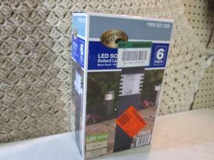 lot 38 image: 6-Pack Solar Black Outdoor Integrat...