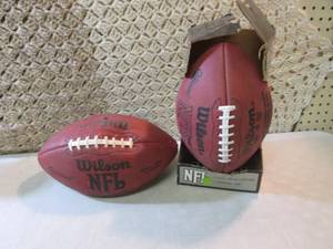 lot 112 image: Lot of 2 Wilson NFL Leather Footbal...