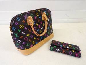 lot 58 image: Louis Buitton Paris Made in France Purse with Clutch