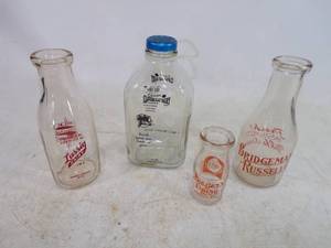 lot 95 image: 4 Vintage Milk Bottles