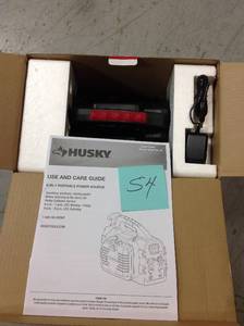lot 54 image: Husky 8-in-1 12-Volt Power SourceJumpstarter in good condition