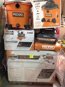 lot 204 image: Pallet of assorted Ridgid Tools Miter Saw, Compressors, Vaccums, Tile saw ,Table saw,  and more all custumer returns RETAIL VALUE OVER $3000