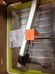 lot 24 image: RYOBI 7 in. 4.8 Amp Tabletop Tile Saw in good condition