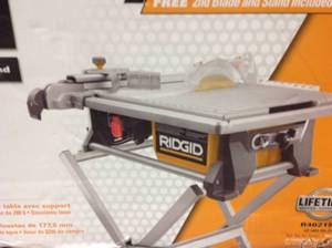 lot 42 image: Ridgid 6.5 Amp 7 in. Table Top Wet Tile Saw with Bonus Stand and Blade in like new condition