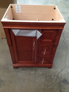 lot 210 image: Home Decorators Collection Naples 24 in. W Bath Vanity Cabinet Only in Warm Cinnamon with Right Hand Drawers