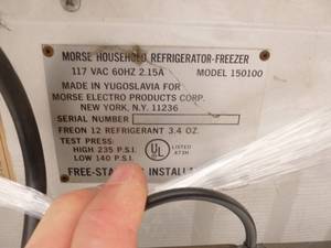 lot 8 image: Compact Refrigeratorfreezer. Used condition but is in good working condition. Has dents on left side. 21 x 20 x 34. As Shown. SEE TERMS