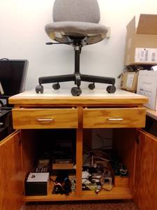 lot 997 image: Cabinet with contents plus chair. 32W x 30H x 24D inches.