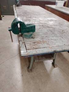 lot 899 image: Workbench with vice (2). 8 x 3 ft. x 35in. Allied and Torgo easy removal through overhead door.  shop