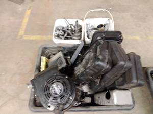 lot 911 image: Misc. Briggs and Stratton Gas Tanks and parts, pistons and cranks.