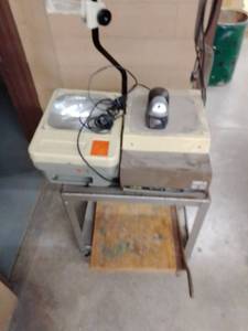 lot 1411 image: Rolling Metal Cart with vintage overhead projectors (2) and paper cutter. Loc shop