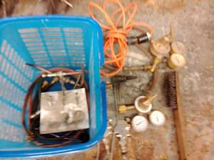 lot 1142 image: Welding Supply Kit, Gauges, electrical cord, striker, torch heads and more.