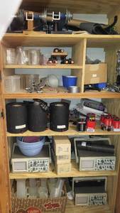 lot 1114 image: Contents of Cupboard Jorgensen Clamp, Beakers, Misc. Electronics, Batteries and more.