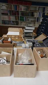 lot 1111 image: Contents of CupboardWood Crates with contents, Texas Instrument, Electric Burners and more.
