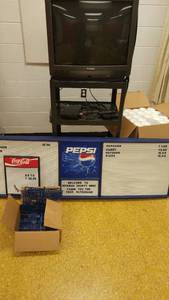 lot 1442 image: Concession Board with numbers, letter, Styrofoam Cups (22 sleeves 40  10oz.) AV Rolling Cart with contents.