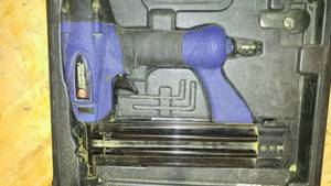 lot 1262 image: Campbell Hausfeld Pneumatic Nailer with case. Nails.