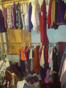 lot 1342 image: Theater Costumes, clothing many boxes on the floor and hanging