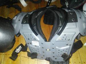lot 849 image: Shoulder Pads and 2 tandem metal racks variety of shoulder pads. about 30