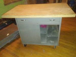lot 853 image: Vintage Metal Cart on casters, sliding door and storage  large work top.