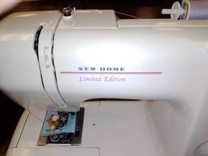 lot 1177 image: New Home 2014 LE Sewing Machine with table.