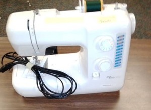 lot 1244 image: Table New Home 2014 LE Sewing Machine with table.