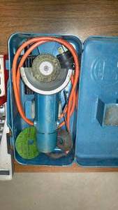 lot 1223 image: Makita Grinder, Table and more. wrenches, socket set, nut drivers.