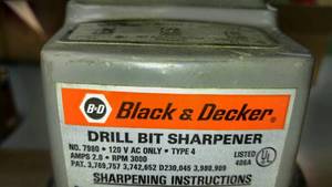 lot 1232 image: D and B Drill Bit Sharpener, Table, hose reel and more.