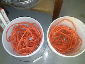 lot 857 image: Extension cords, NEW toilet seats, clocks and more.
