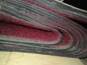 lot 862 image: Entrance mats entryway, carpeted, heavy rubber backing. variety of colors and lengths 49in wide.