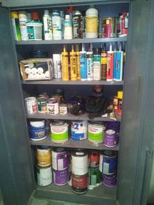 lot 1123 image: Metal Cabinet 72 x 36 x 18in with contents. Caulk, paint, mask and more. Climate controlled.